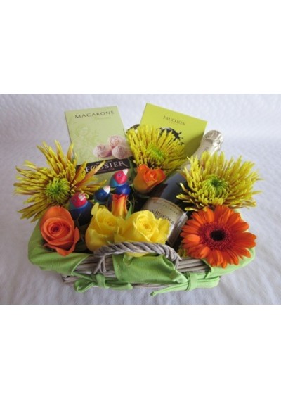 Gift basket with bouquet of flowers