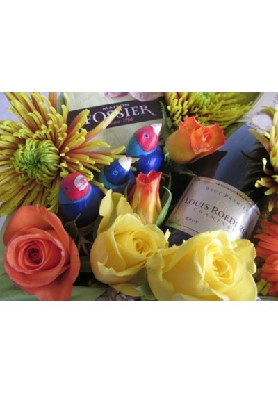 Gift basket with bouquet of flowers