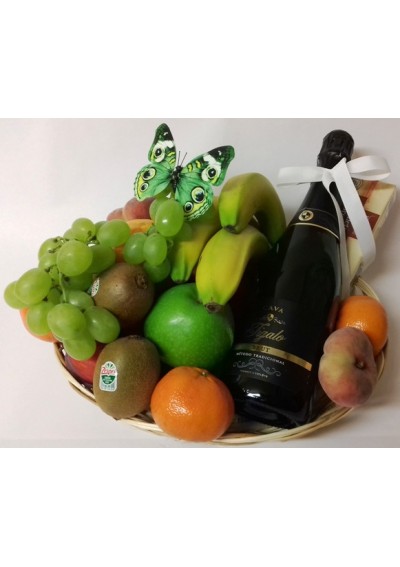 Basket of fresh fruit with a bottle of Cava