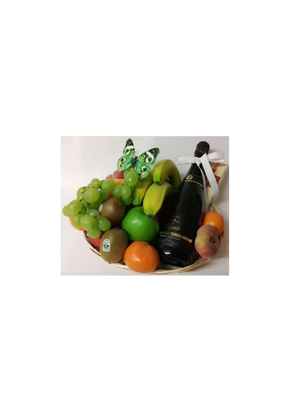 Basket of fresh fruit with a bottle of Cava